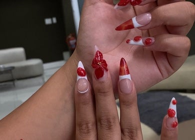 Elegant red and white floral nail art at Nelgai Beauty, Cape Town, Western Cape, ZA.
