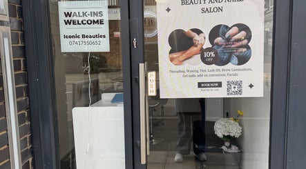 Iconic Beauties in Hayes, England showcases its salon entrance with enticing beauty services signage.