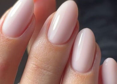 Close-up of manicured nails with soft pink polish at Iconic Beauties, Hayes, England, GB.