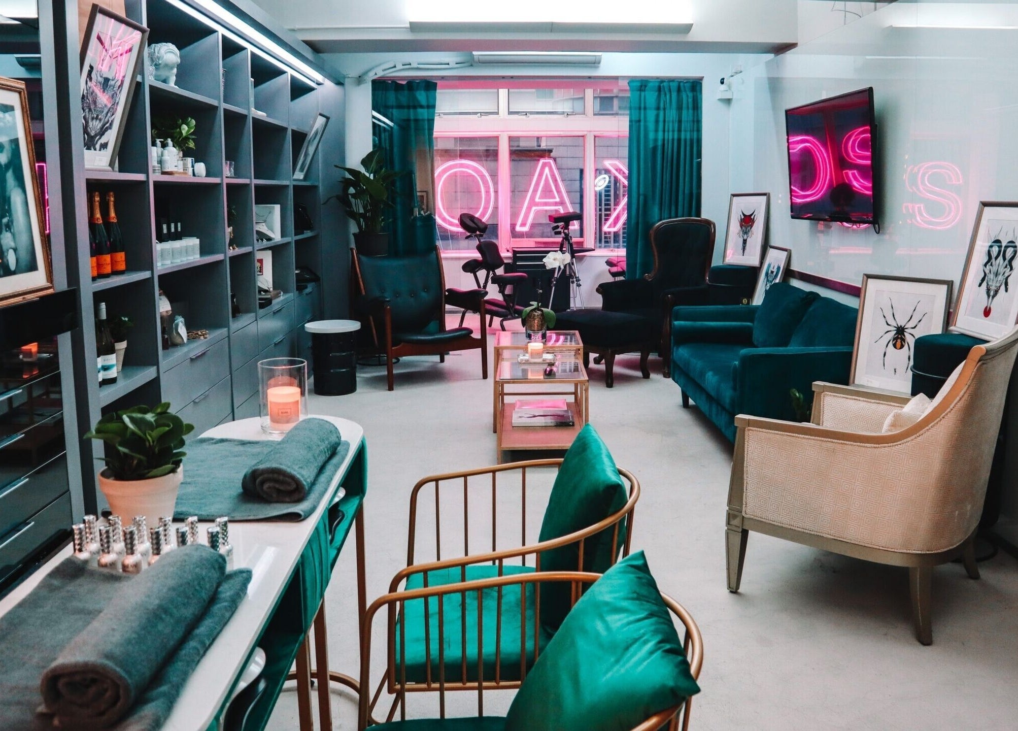 Elegant interior of Kaos, a beauty venue on Hong Kong Island, featuring plush seating and stylish decor.
