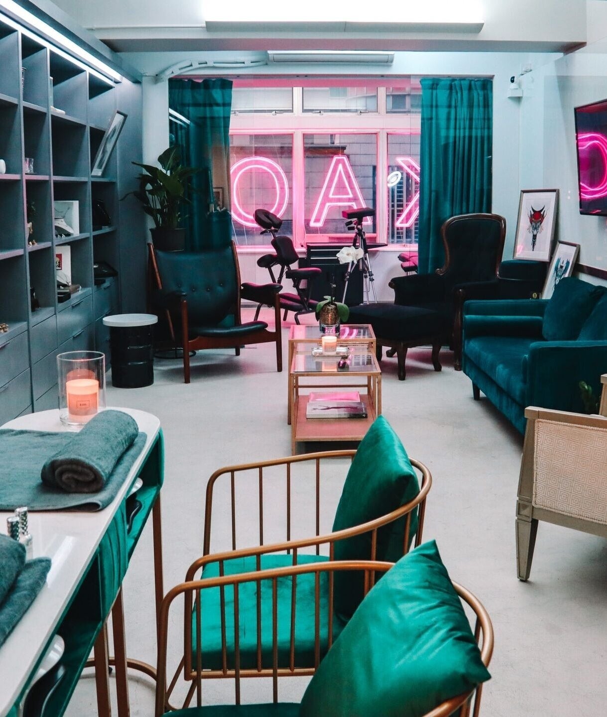 Elegant interior of Kaos, a beauty venue on Hong Kong Island, featuring plush seating and stylish decor.