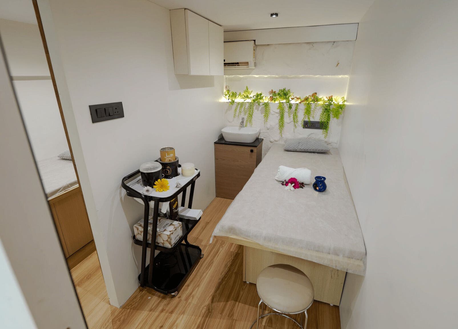 Relaxing spa treatment room at Mist Salon, Spa & Nail Salon, Pune, Maharashtra, IN with calming decor.