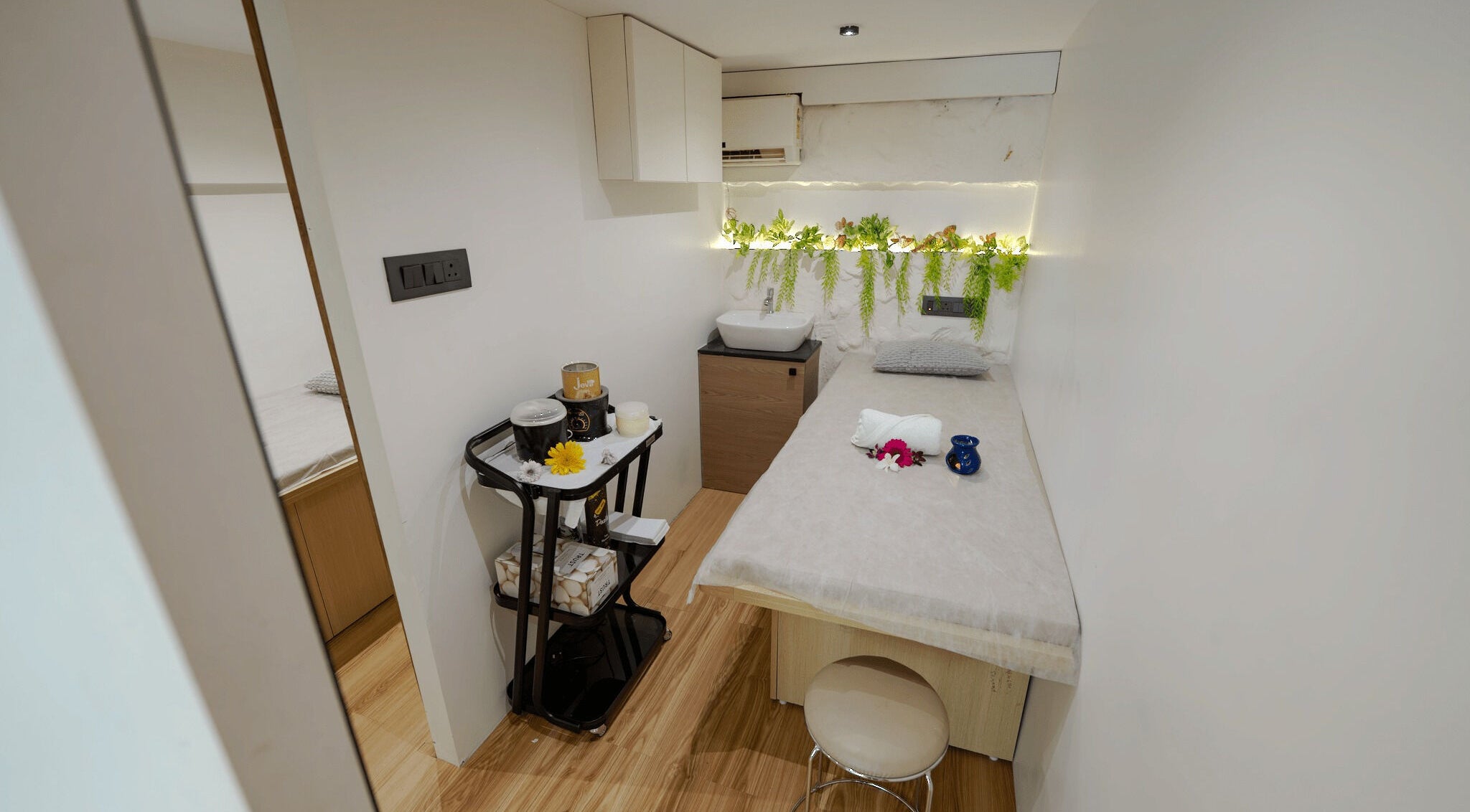 Relaxing spa treatment room at Mist Salon, Spa & Nail Salon, Pune, Maharashtra, IN with calming decor.