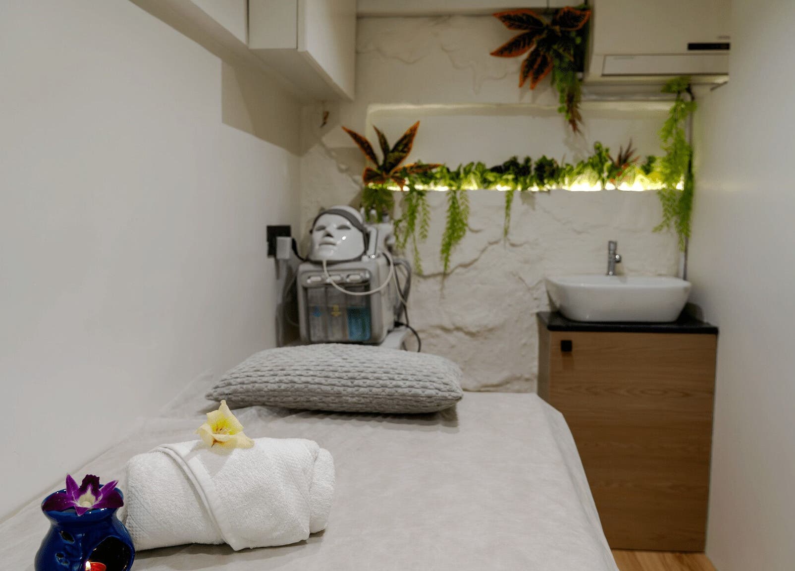 Relaxing spa room at Mist Salon, Spa & Nail Salon in Pune, Maharashtra, IN, featuring a serene massage table.