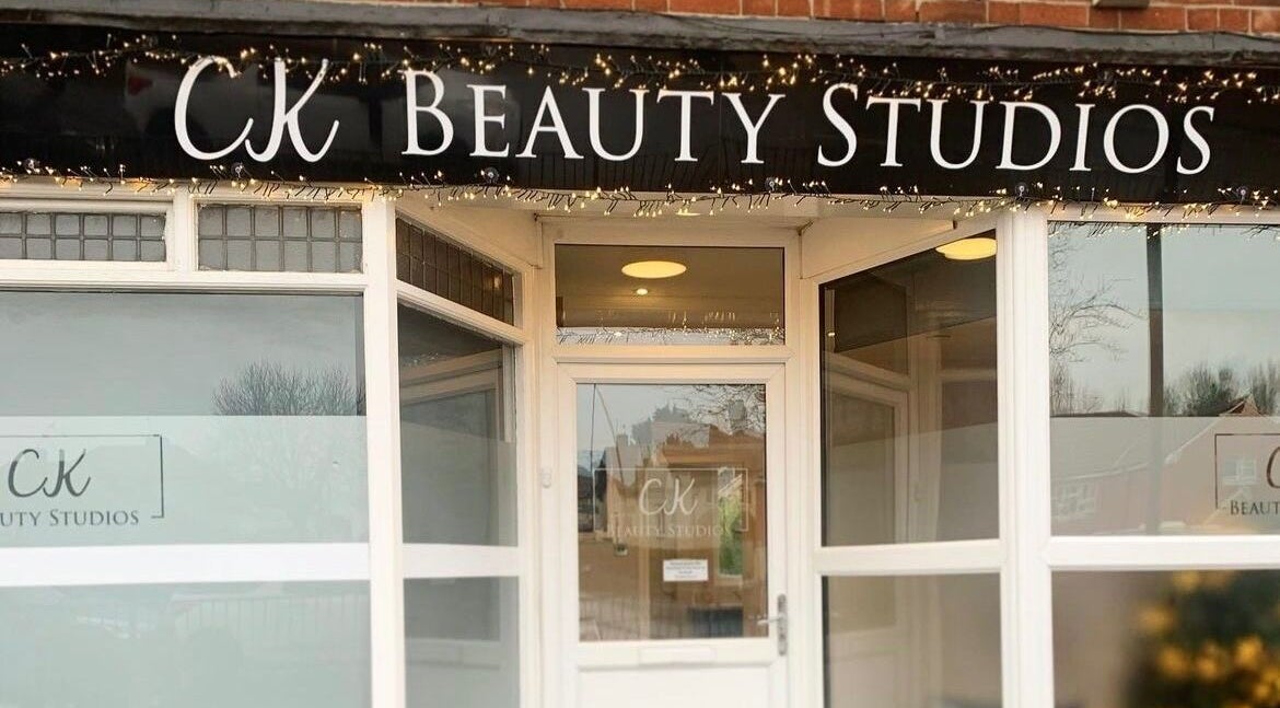 Entrance of CK Beauty Studios in Ilkeston, England, GB with elegant signage.