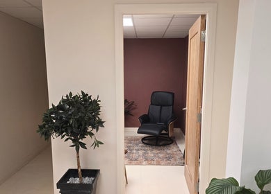 Lounge chair in serene room at Oxygen Cove Cork, Cork, County Cork, IE. Inviting relaxation and comfort.
