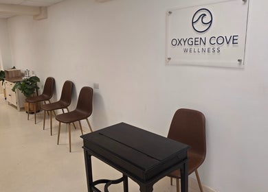 Welcoming waiting area at Oxygen Cove Cork with chairs and decor, located in Cork, County Cork, IE.