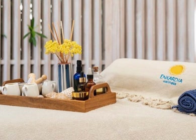 Relaxing spa setup at Enkardia Wellness in Γλυφάδα, GR with oils and towels for a calming experience.