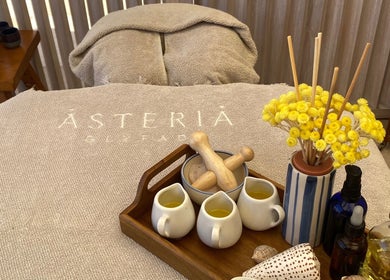Relaxing massage table setup with oils at Enkardia Wellness, Γλυφάδα, GR.