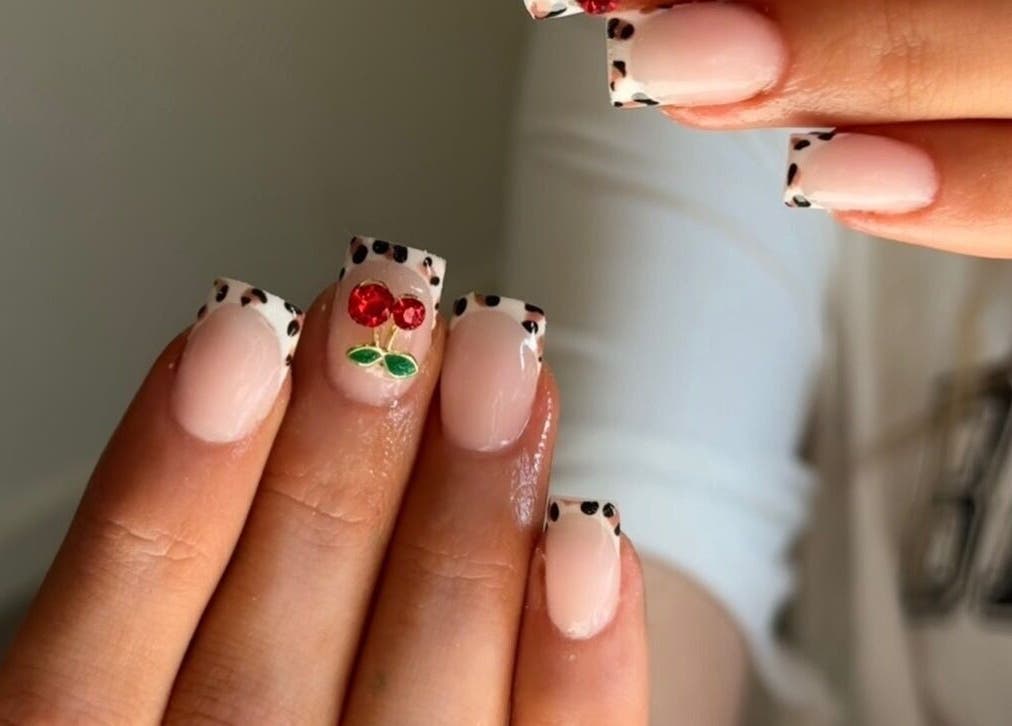 Stylish cherry-themed nail art from BeauteDeLuxeByMia, Selsey, England, GB.