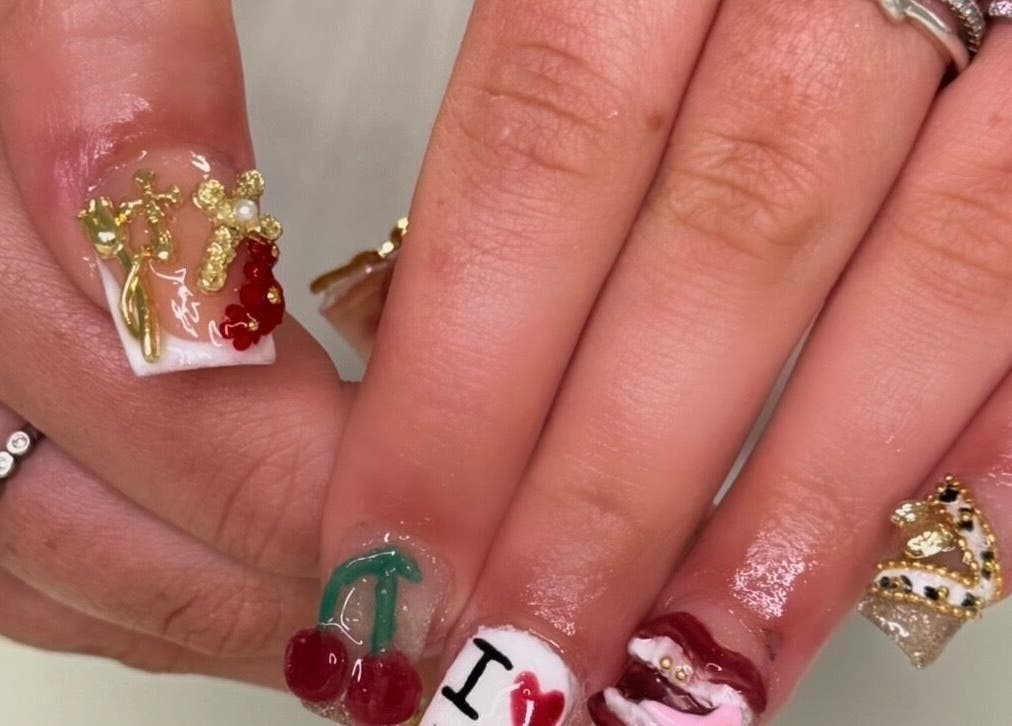 Intricate nail art with gold accents at BeauteDeLuxeByMia, Selsey, England, GB enhancing modern style.