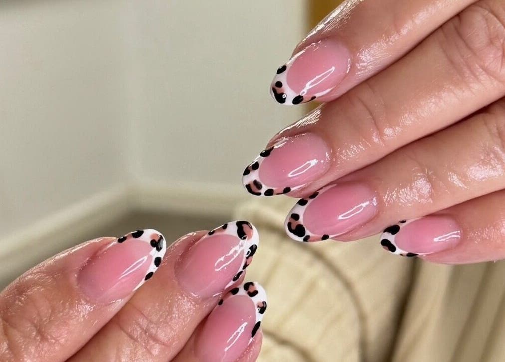 Chic leopard print French manicure at BeauteDeLuxeByMia, Selsey, England, GB.