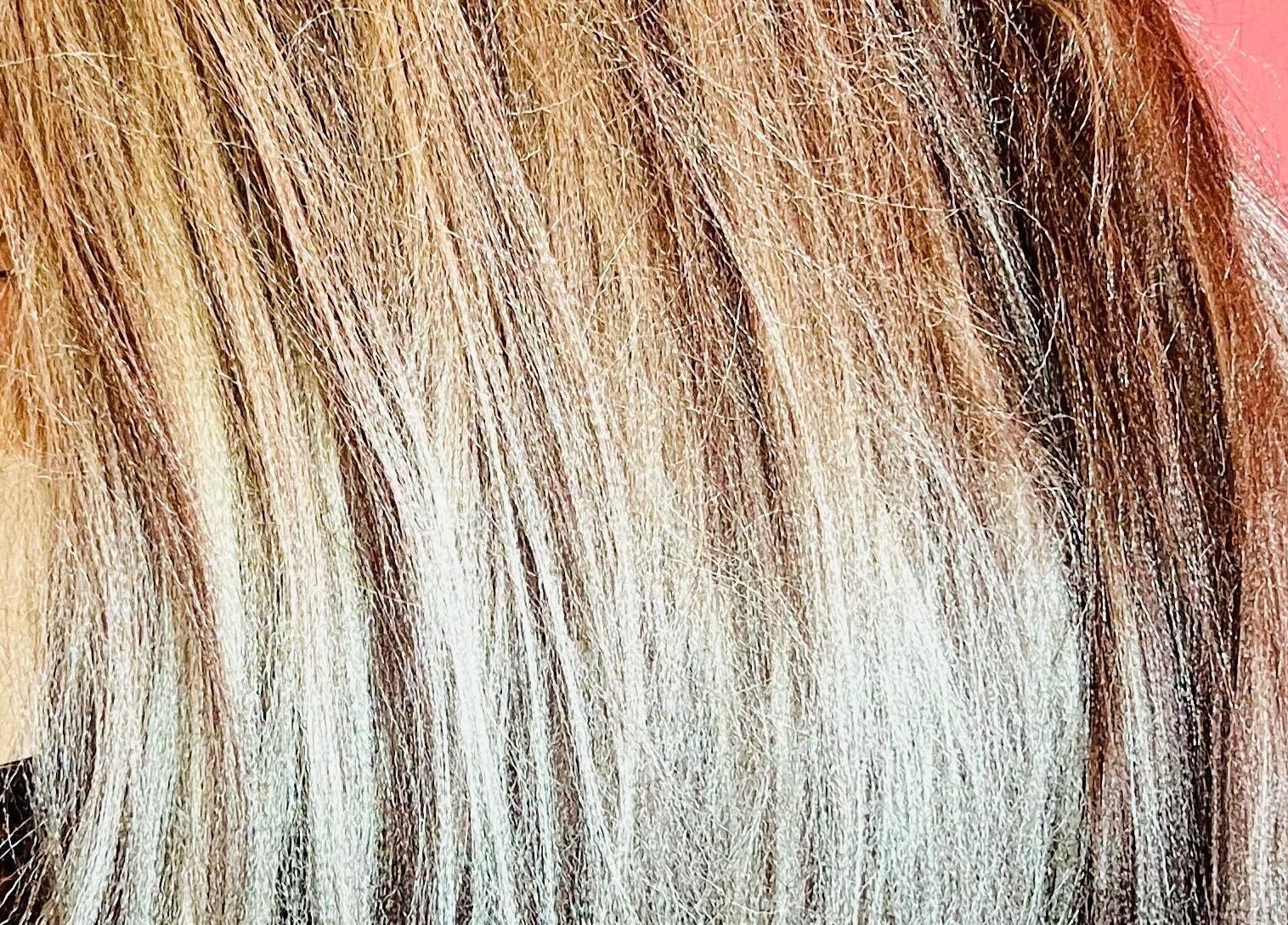 Vibrant blonde highlights expertly styled at Styled by Nads, London, England, GB.