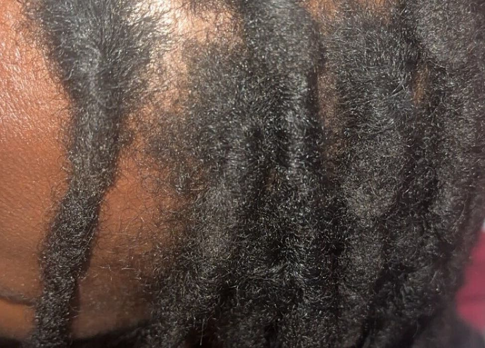 Close-up of styled braids at Styled by Nads, London, England, GB, showcasing detailed texture.