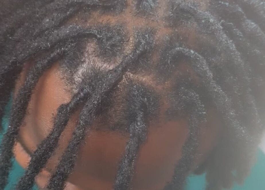 Styled by Nads in London, England, GB showcases intricate dreadlock styling on natural hair.