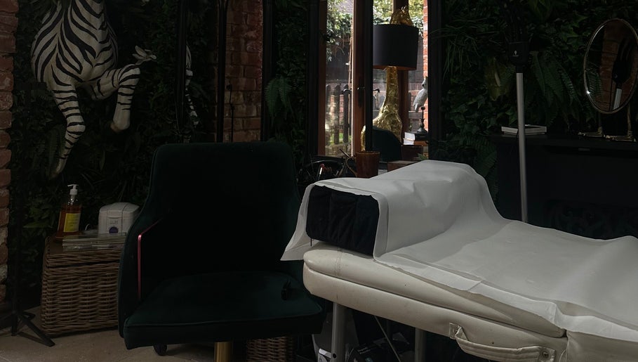 Luxurious treatment room at I D BEAUTY, Stoke-on-Trent, England, GB with elegant decor and lush greenery.