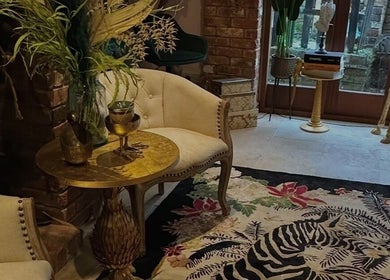 Luxurious lounge area at I D BEAUTY, Stoke-on-Trent, England, GB, showcasing chic decor and plush seating.