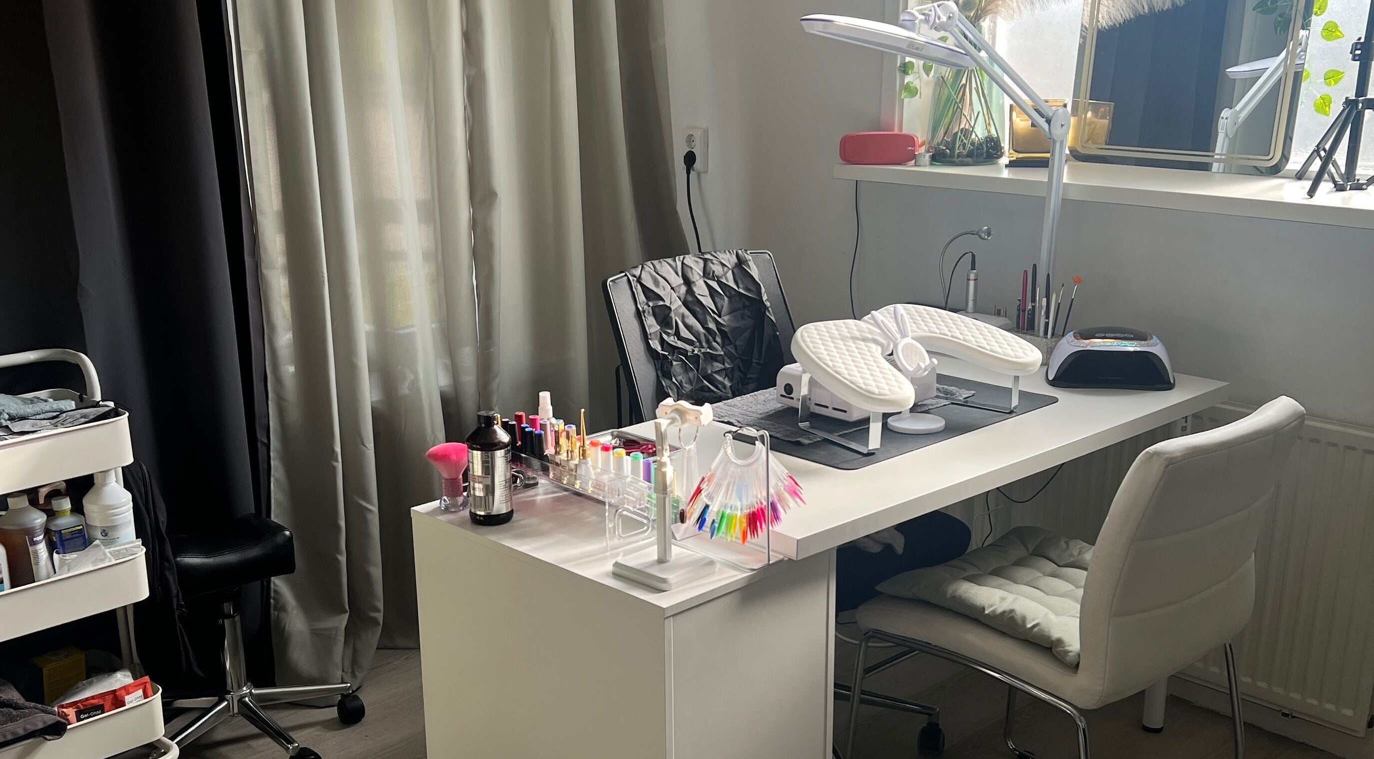 Sleek nail station at Nailed by Joanne, Driebruggen, Zuid-holland, NL showcasing polish and modern decor.