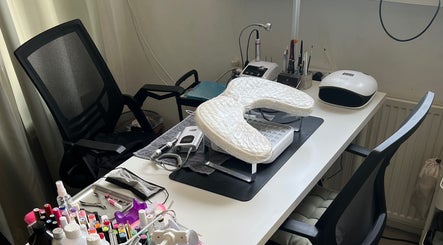 Professional nail station at Nailed by Joanne, Driebruggen, Zuid-holland, NL, featuring tools and cozy chairs.