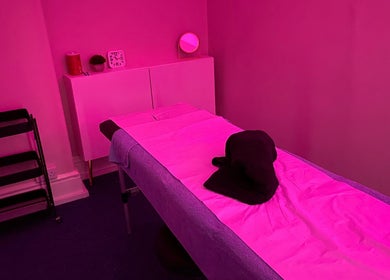Tranquil massage room with pink lighting at Majestic Beauty, Plymouth, England, GB.