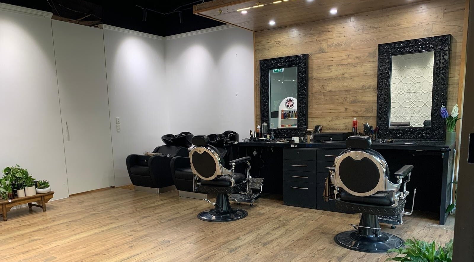 Elegant salon chairs and mirrors at Eagle’s Nest Salon, Hornsby, New South Wales, AU.