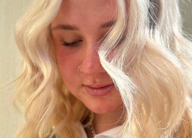 Blonde woman with wavy hair at The Hair Lounge, Emerald, Queensland, AU.