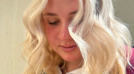 Blonde woman with wavy hair at The Hair Lounge, Emerald, Queensland, AU.