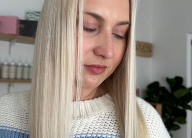 Close-up of a woman's smooth blonde hair at The Hair Lounge, Emerald, Queensland, AU.