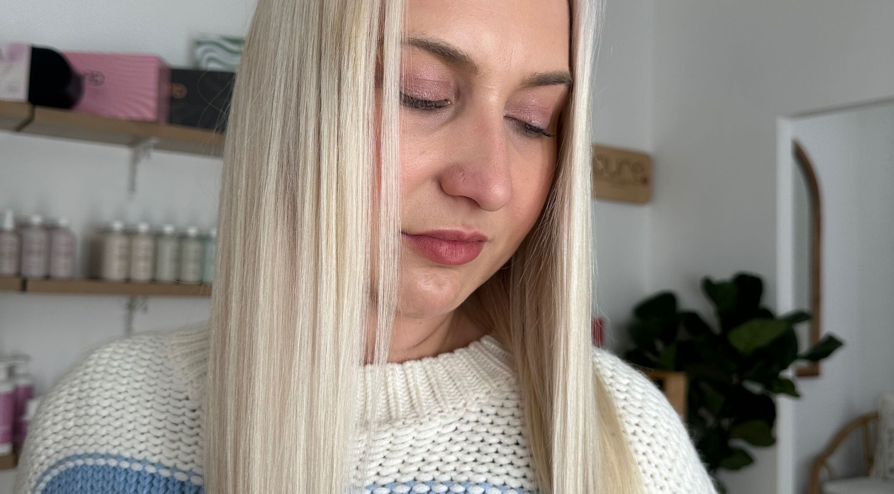 Close-up of a woman's smooth blonde hair at The Hair Lounge, Emerald, Queensland, AU.