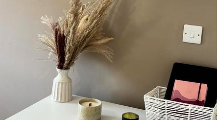 Ethereal Beauty's serene decor with vase and candles, Lydney, England, GB.