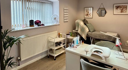 Cozy spa room at LTbeauty, Newton Abbot, England, GB, featuring treatment bed and manicure station.