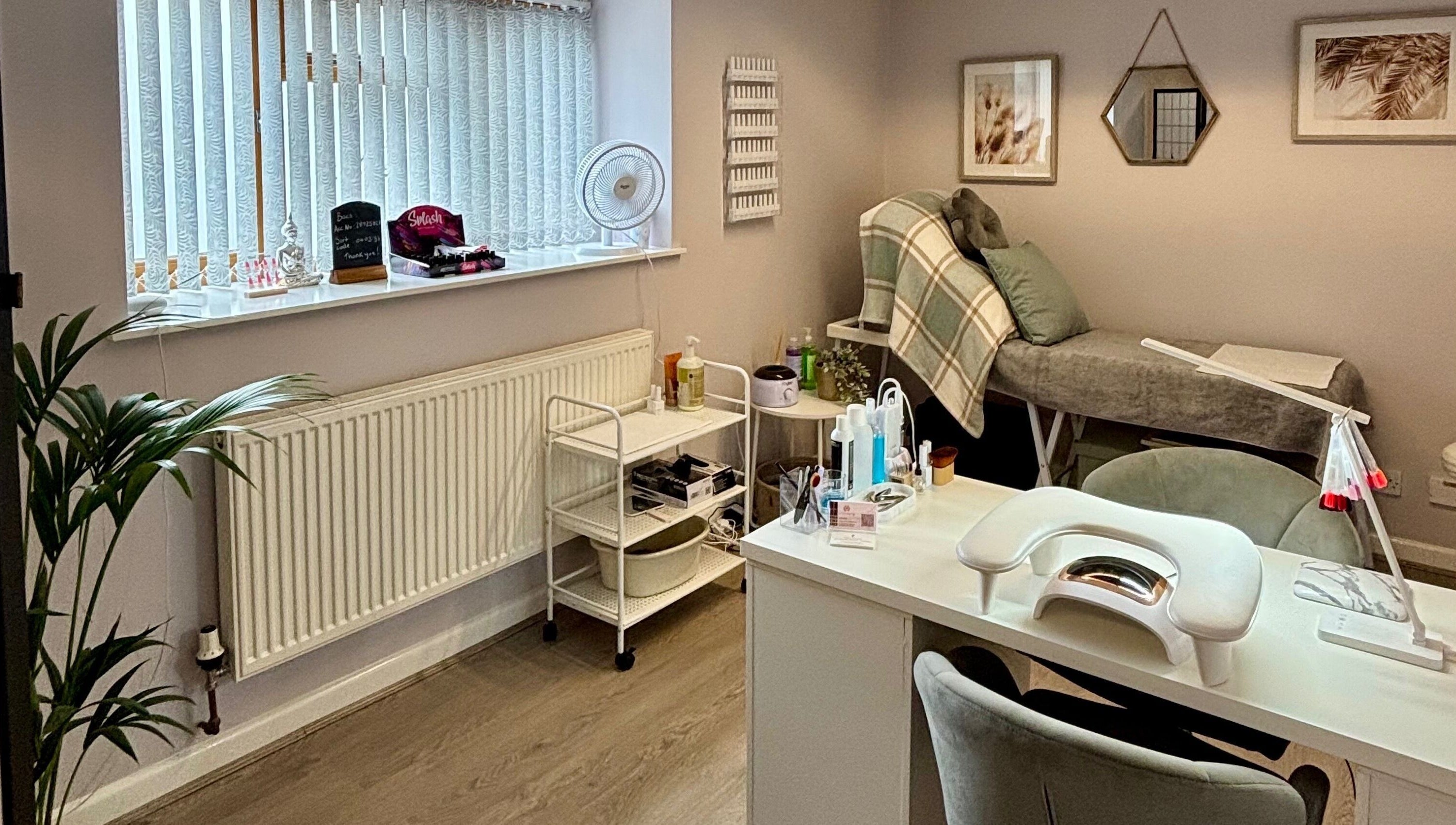 LTbeauty salon interior with a cozy treatment bed and modern decor in Newton Abbot, England, GB.