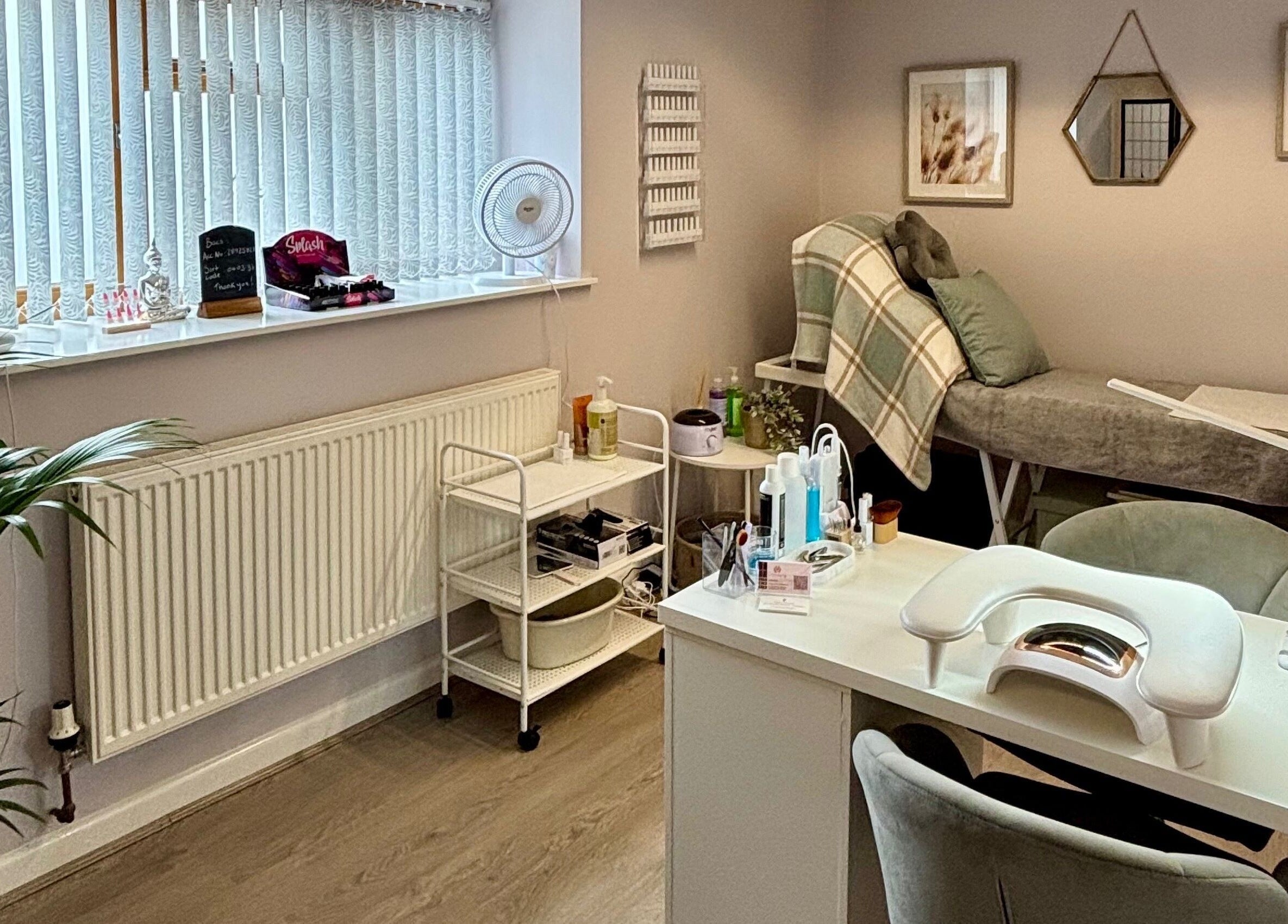LTbeauty salon interior with a cozy treatment bed and modern decor in Newton Abbot, England, GB.
