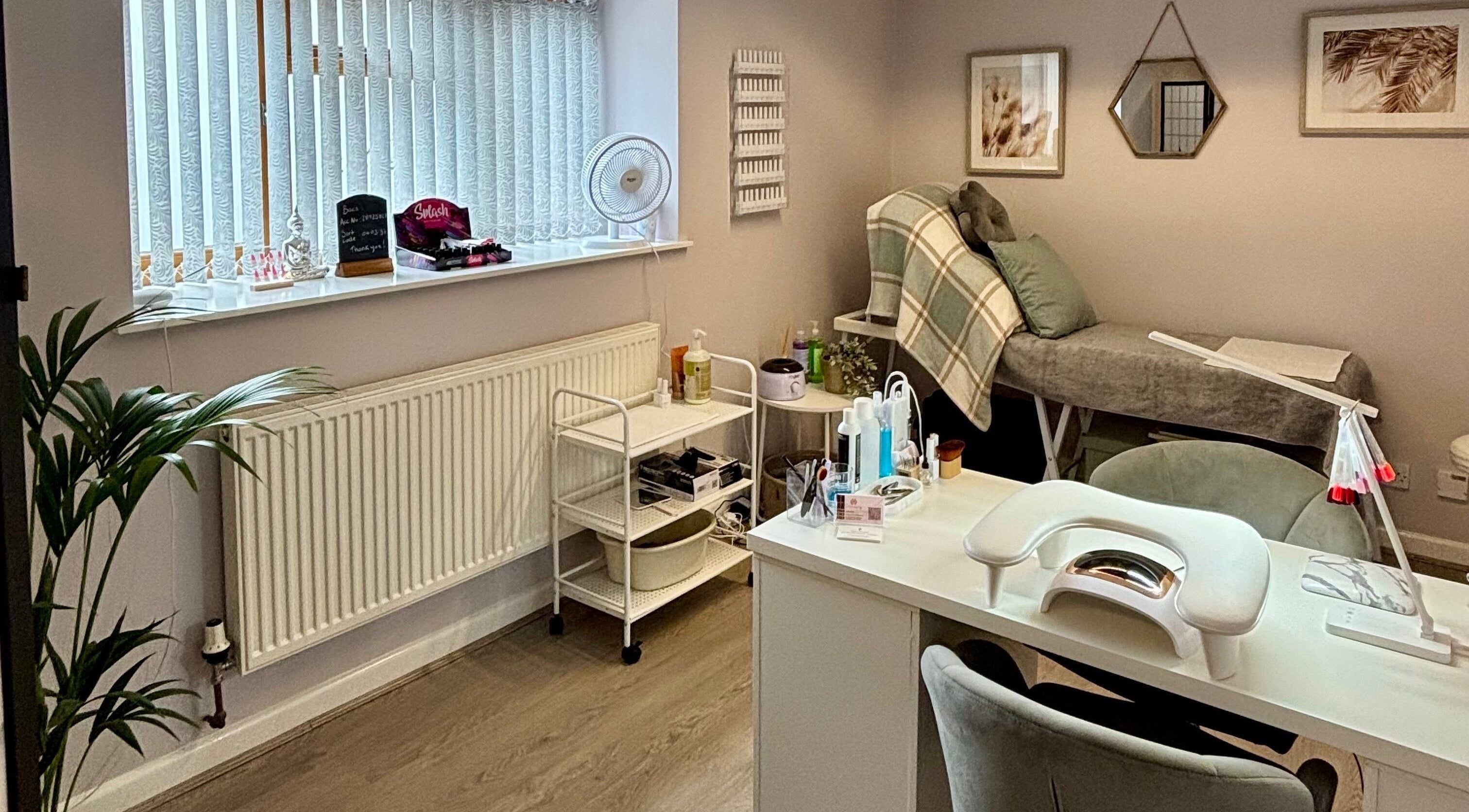 LTbeauty salon interior with a cozy treatment bed and modern decor in Newton Abbot, England, GB.