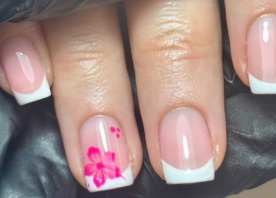 Elegant French manicure with pink floral design at LTbeauty, Newton Abbot, England, GB.