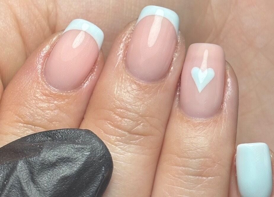 French manicure with heart design at LTbeauty in Newton Abbot, England, GB. Perfect nail art for any occasion.