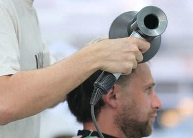 Stylist perfecting a haircut at Source Barbers, Aberdeen, Scotland, GB.