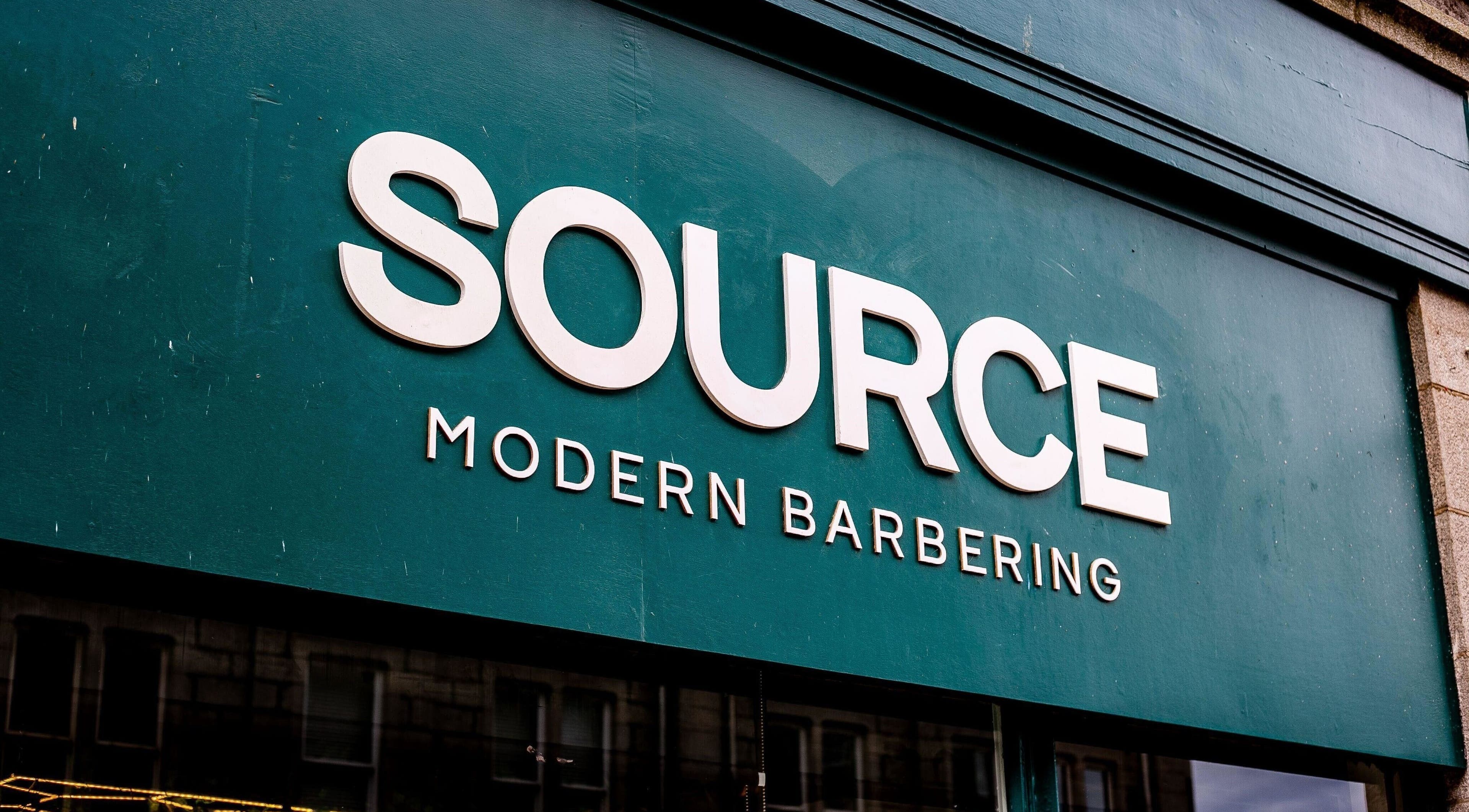 Signage of Source Barbers, modern barbershop in Aberdeen, Scotland, GB.