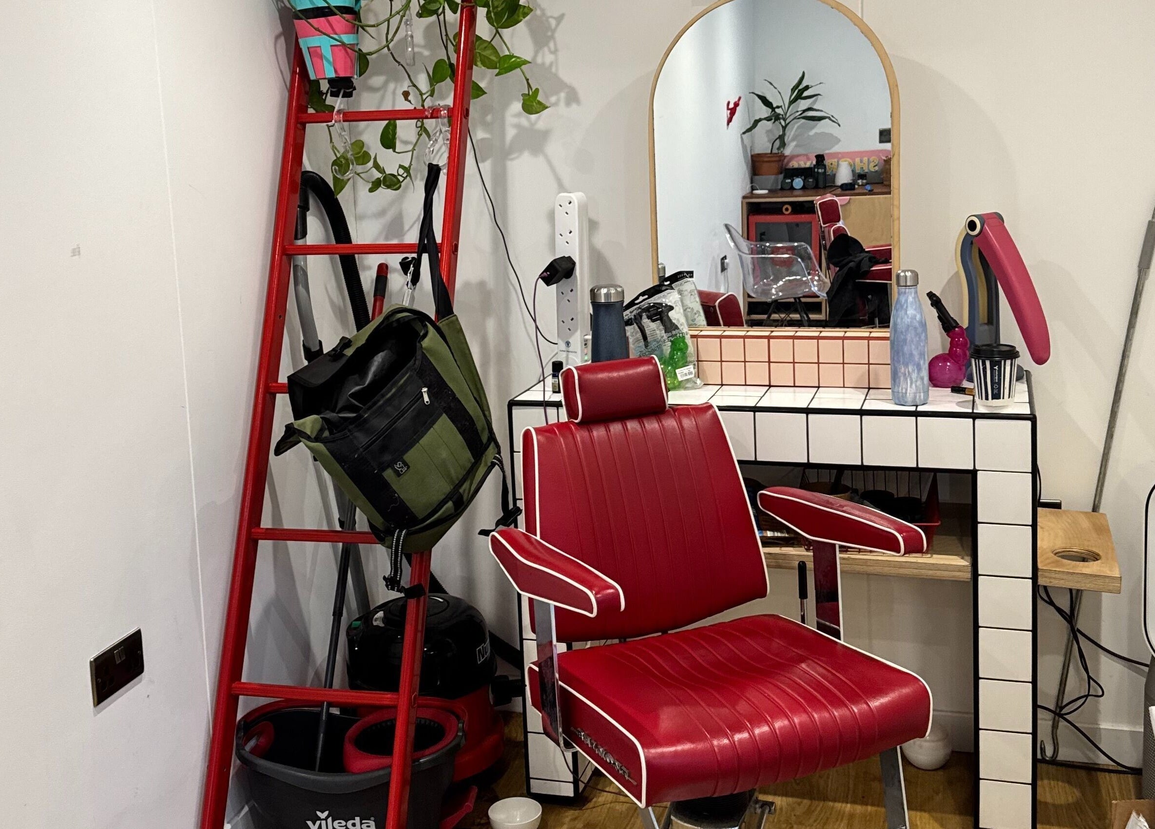 Retro red chair and mirror setup at Shortys - Leicester, showcasing a stylish salon space in Leicester, England, GB.