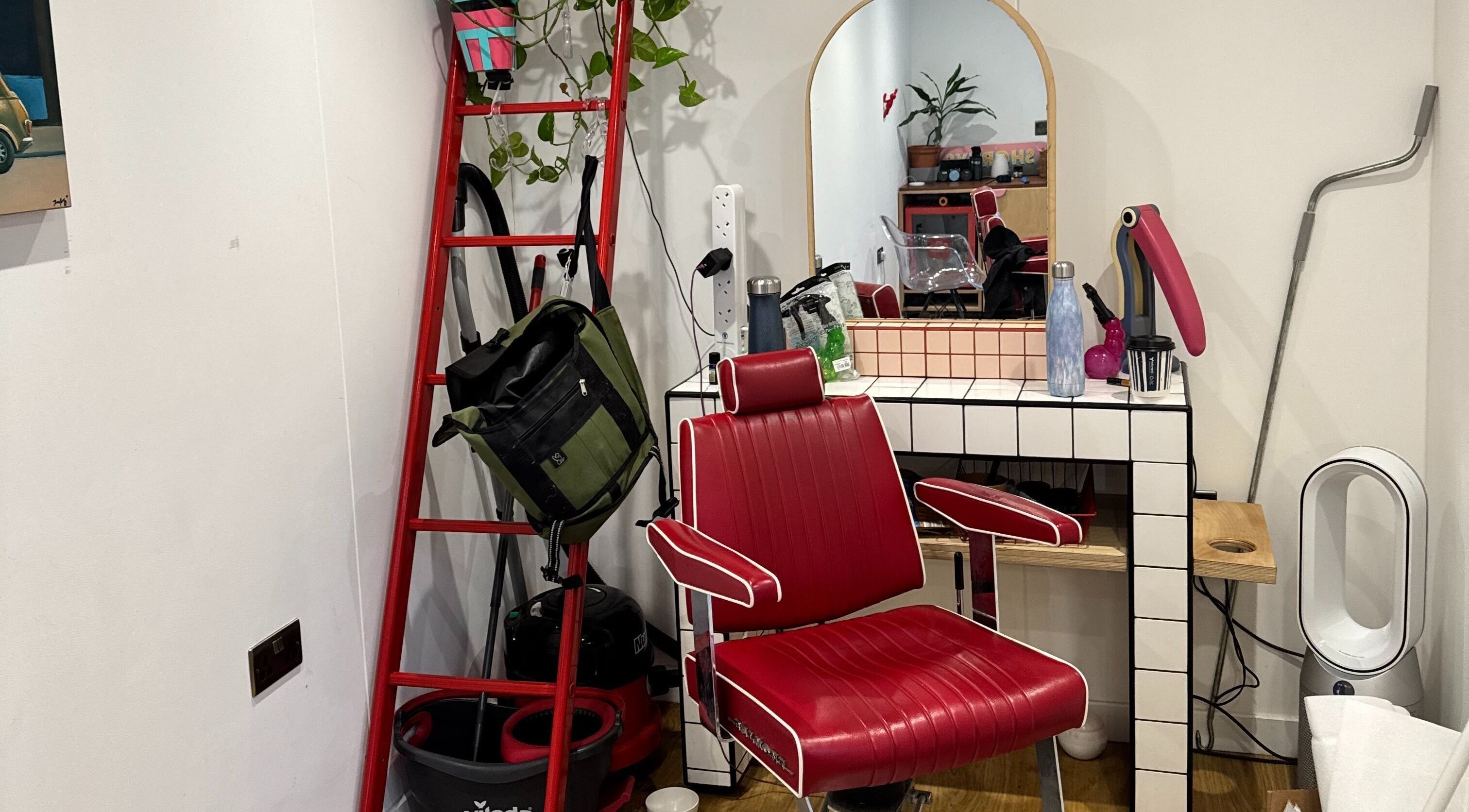 Retro red chair and mirror setup at Shortys - Leicester, showcasing a stylish salon space in Leicester, England, GB.