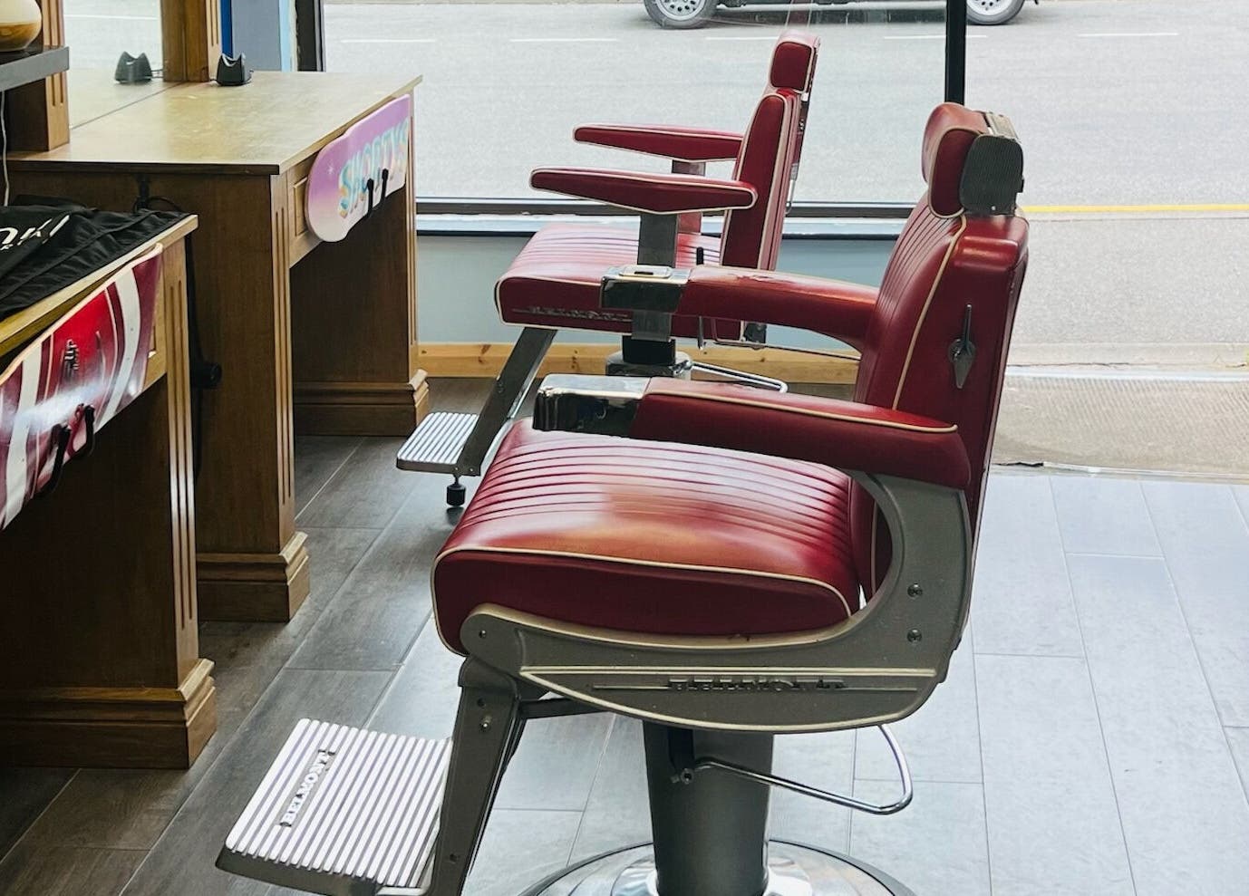 Red barber chairs at Shortys - Markfield, England, GB, showcasing a vintage style and welcoming environment.