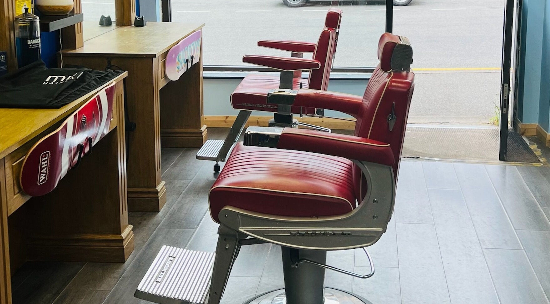 Red barber chairs at Shortys - Markfield, England, GB, showcasing a vintage style and welcoming environment.