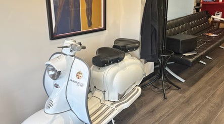 Vintage scooter and modern lounge at Shortys - Markfield, Markfield, England, GB. Unique decor enhances ambiance.