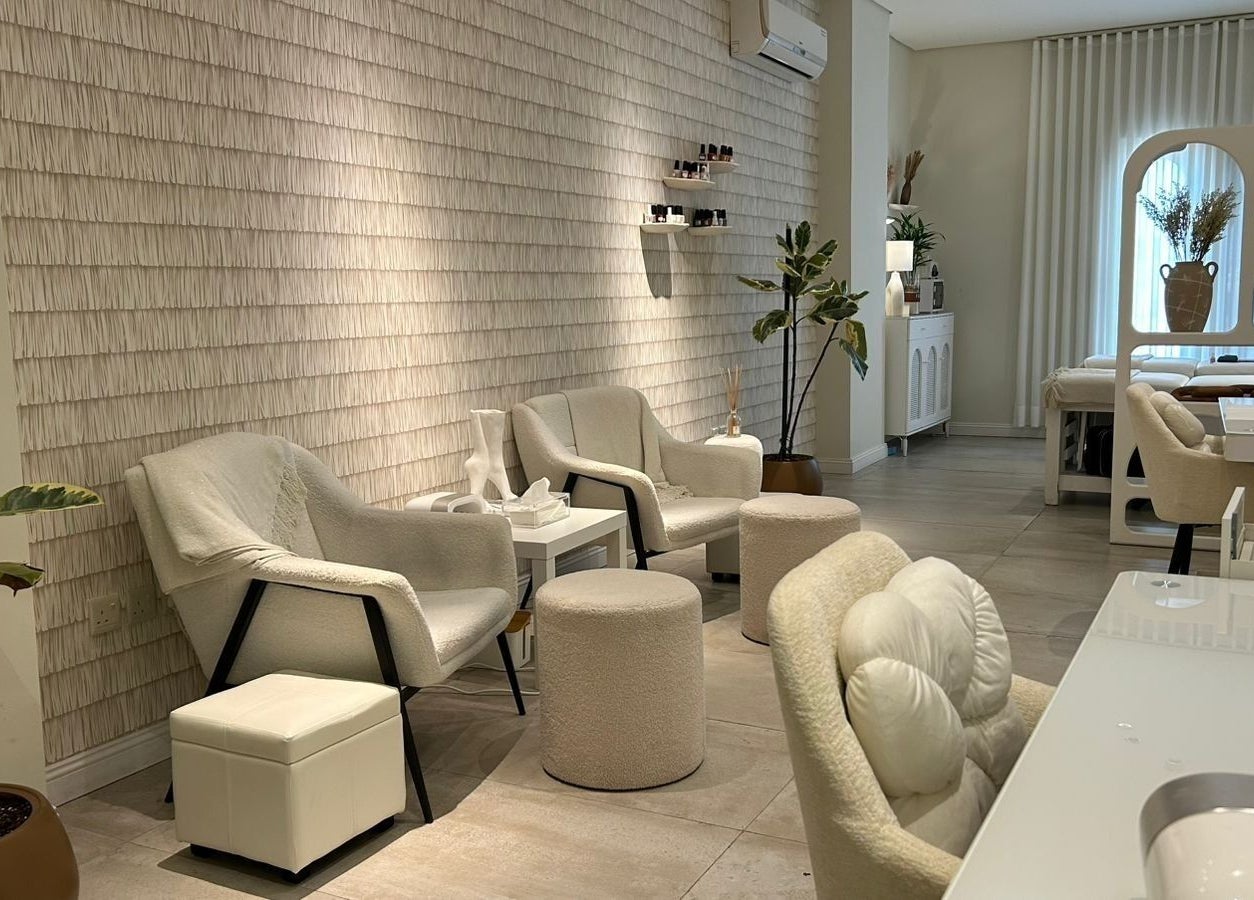 Luxurious interior of Nash & More in Jeddah, Makkah Province, SA with plush chairs and calming decor.