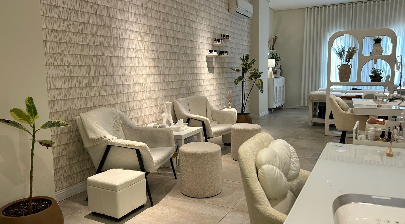 Luxurious interior of Nash & More in Jeddah, Makkah Province, SA with plush chairs and calming decor.