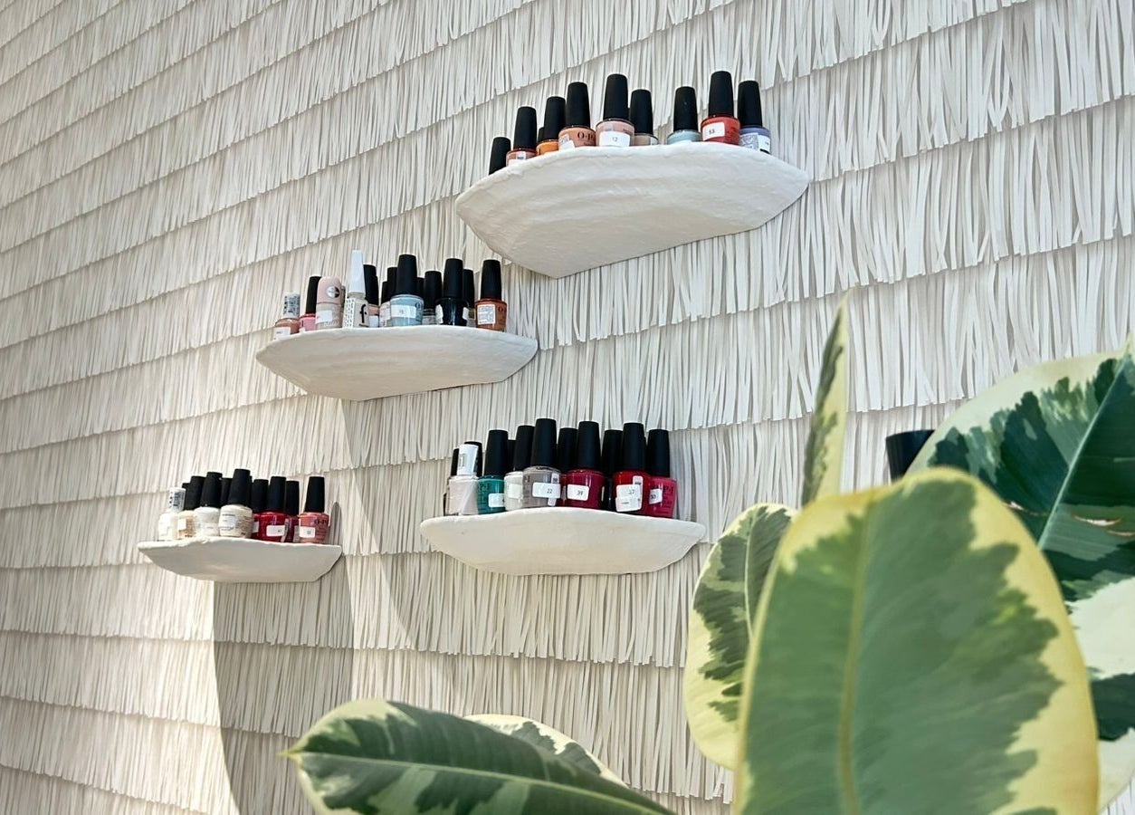 Nail polish collection on modern shelves at Nash & More, Jeddah, Makkah Province, SA.