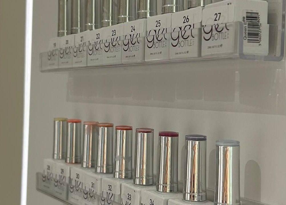 Array of nail polish bottles at Nash & More, Jeddah, Makkah Province, SA, showcasing vibrant colors.