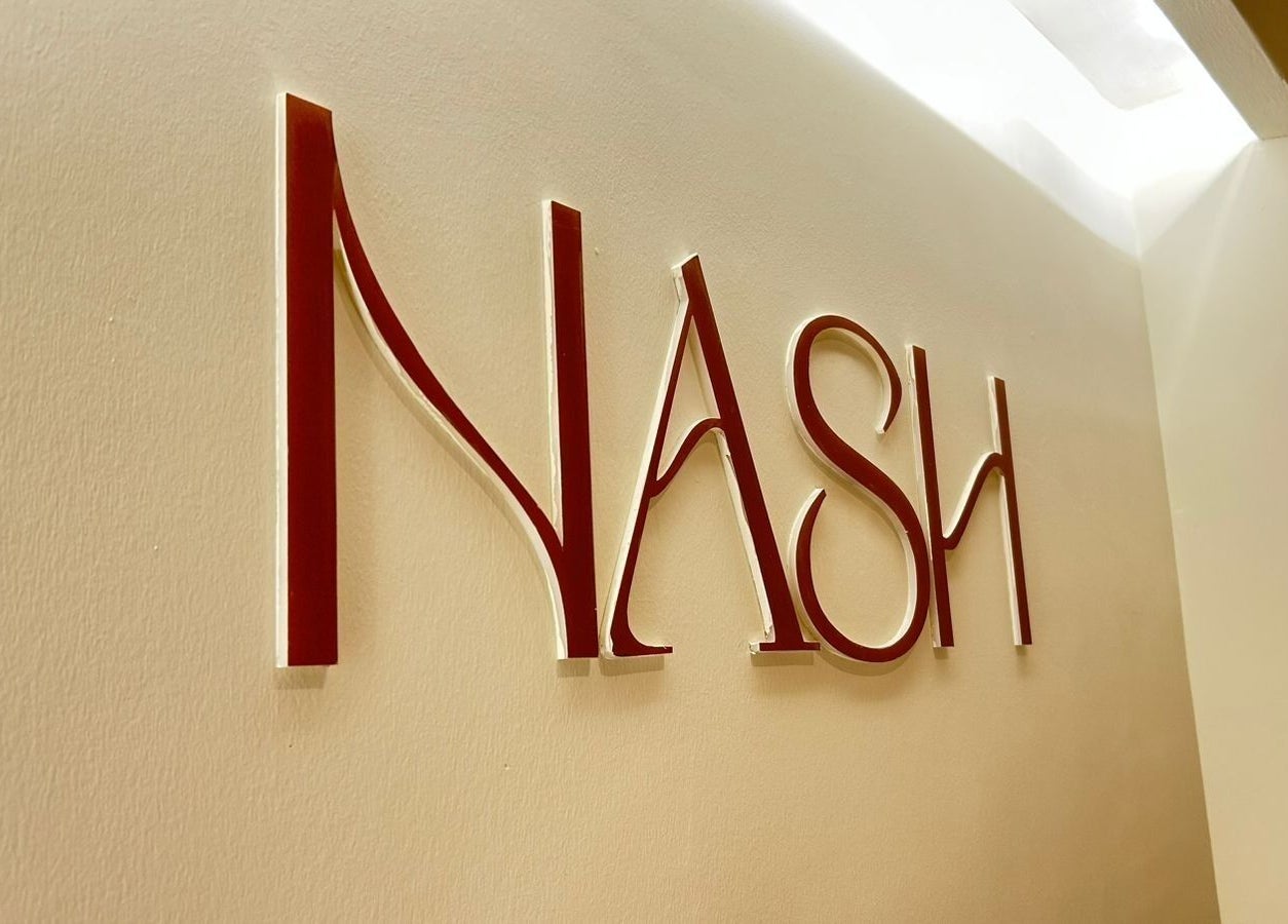 Elegant red lettered Nash sign at Nash & More, Jeddah, Makkah Province, SA.