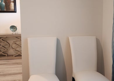 Elegant chairs in Scalp & Strand Wellness Studio, Columbia, South Carolina, creating a calming reception area.