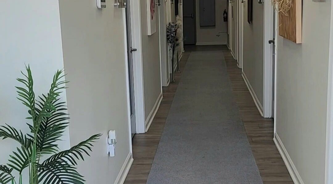 Bright hallway at Studio 1000 | Scalp & Strand Wellness Studio, Columbia, South Carolina, US, with decor plants.